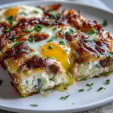Amish Breakfast Casserole with Hash Browns, Eggs and Sausage: A golden-baked dish filled with crispy hash browns, savory sausage, and melted cheese, perfect for family breakfasts.