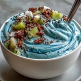 Creamy, visually stunning blue spirulina smoothie bowl, ready to be devoured.