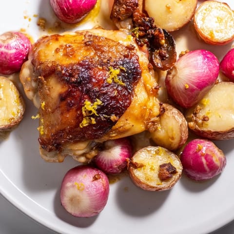 Juicy roasted radish and chicken sheet pan with crispy skin and bright lemon zest over tender vegetables.