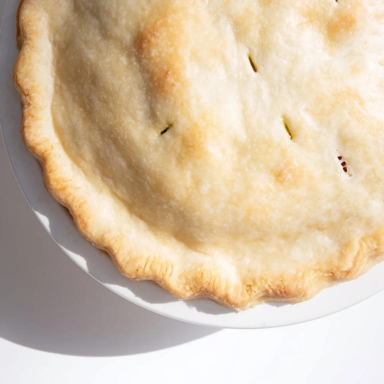 Get ready to enjoy this comforting Chicken Pot Pie fresh from the oven, steaming.