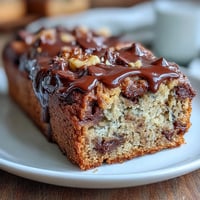 Moist, protein-packed banana bread with rich dark chocolate chips, perfect for a healthy breakfast or snack.  