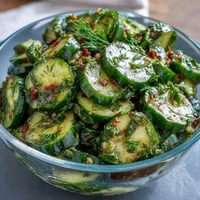 A vibrant cucumber radish salad with dill vinaigrette, bursting with fresh crunch and zesty flavor.  